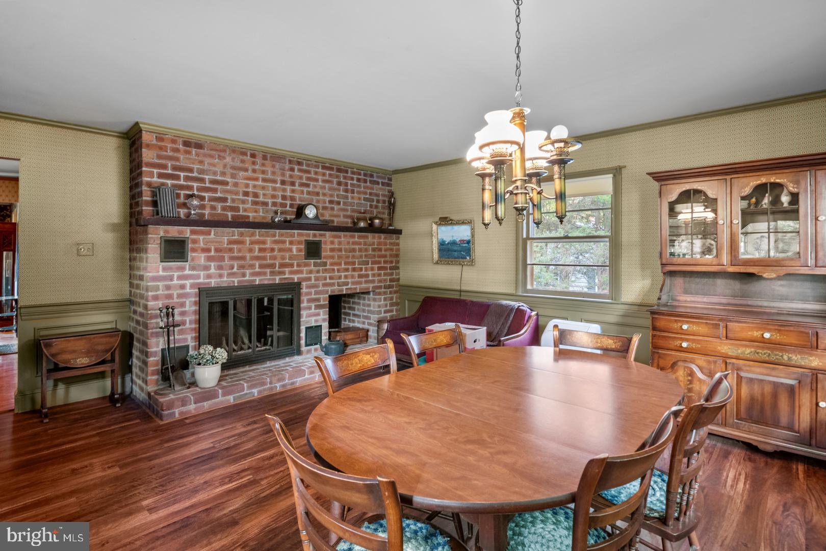 207 Laurel Avenue Hamburg, PA 19526 - Photo 8 of 25 a dining room with furniture a chandelier and wooden floor