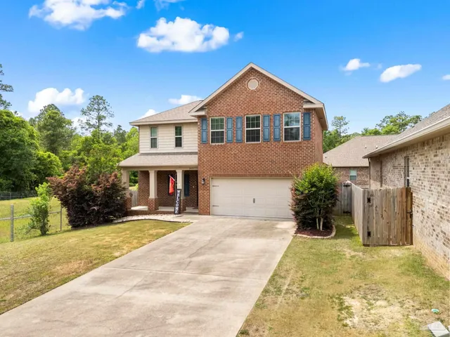 a front view of a house with yard