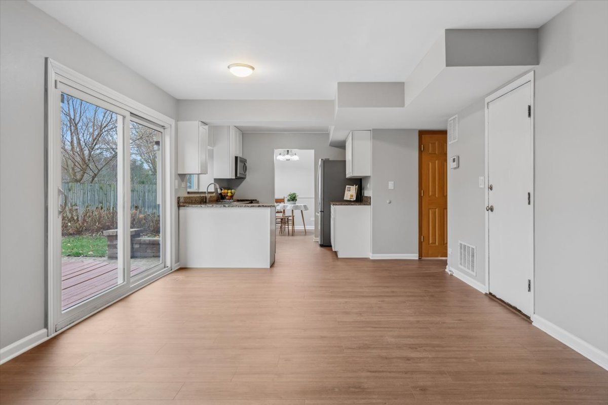 3131 Portland Court Aurora, IL 60504 - Photo 11 of 20 a view of a kitchen with refrigerator and wooden floor