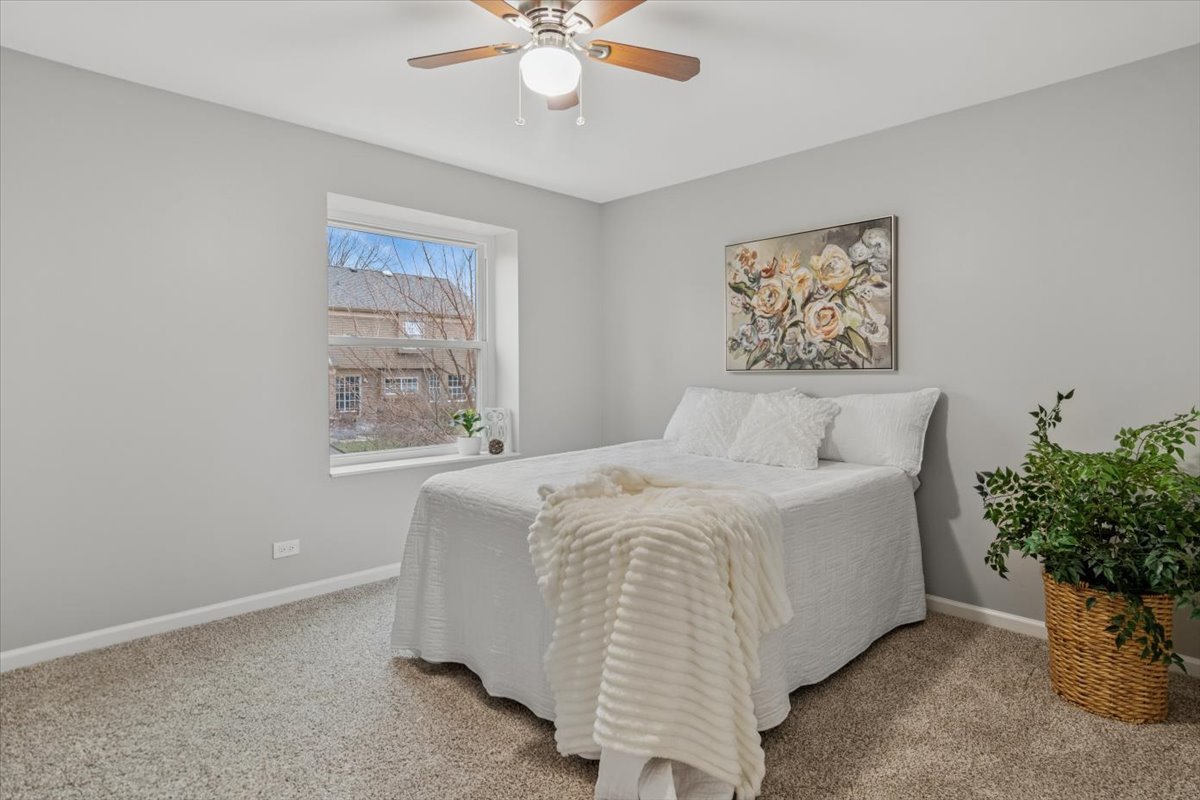 3131 Portland Court Aurora, IL 60504 - Photo 13 of 20 a bedroom with a bed and a window