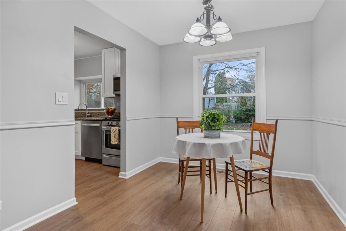 3131 Portland Court Aurora, IL 60504 - Photo 5 of 20 a view of a dining room with furniture window and wooden floor
