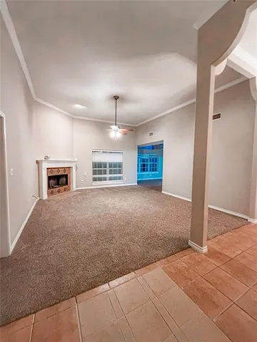 an empty room with furniture and a window