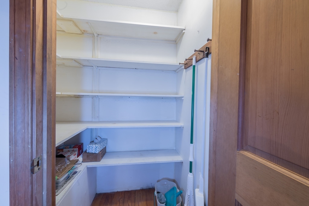 4 Coombs Road Rochester, MA 02770 - Photo 9 of 27 a room with a closet and wooden shelves