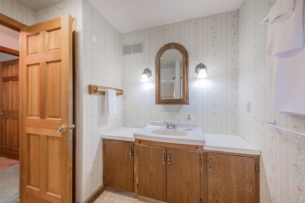 4 Coombs Road Rochester, MA 02770 - Photo 10 of 27 a bathroom with a double vanity sink and a mirror