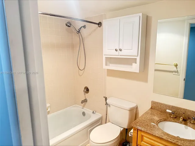 a bathroom with a sink a toilet and a bathtub
