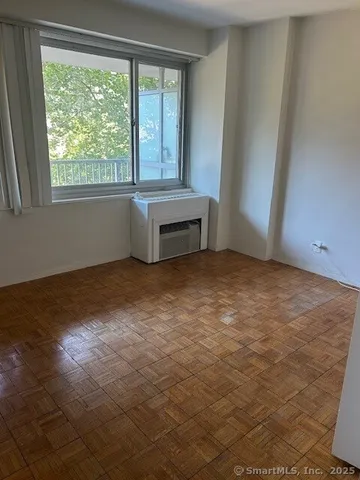 a view of an empty room with a window