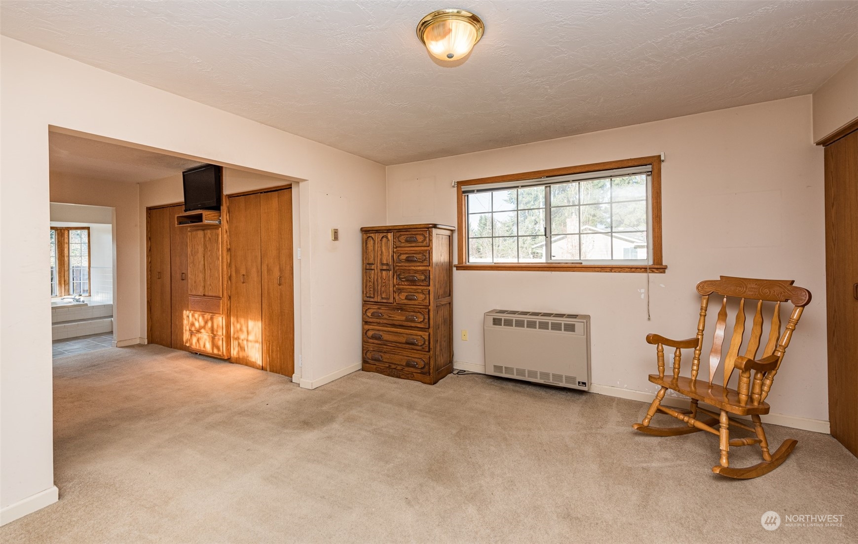 970 River Road Sequim, WA 98382 - Photo 12 of 40 an empty room with furniture and windows