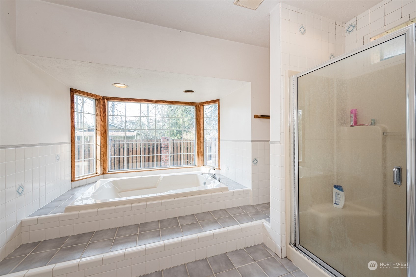 970 River Road Sequim, WA 98382 - Photo 16 of 40 a bathroom with a bathtub and a shower