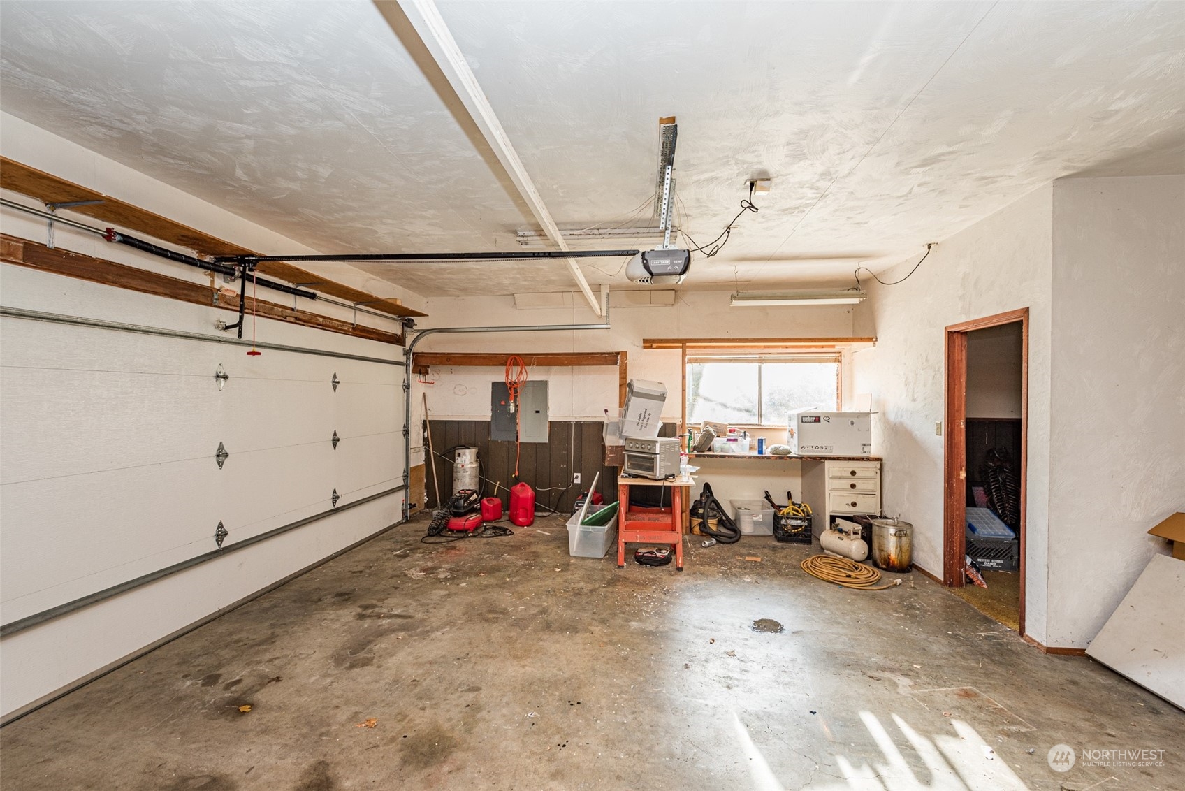 970 River Road Sequim, WA 98382 - Photo 17 of 40 a view of a garage with storage
