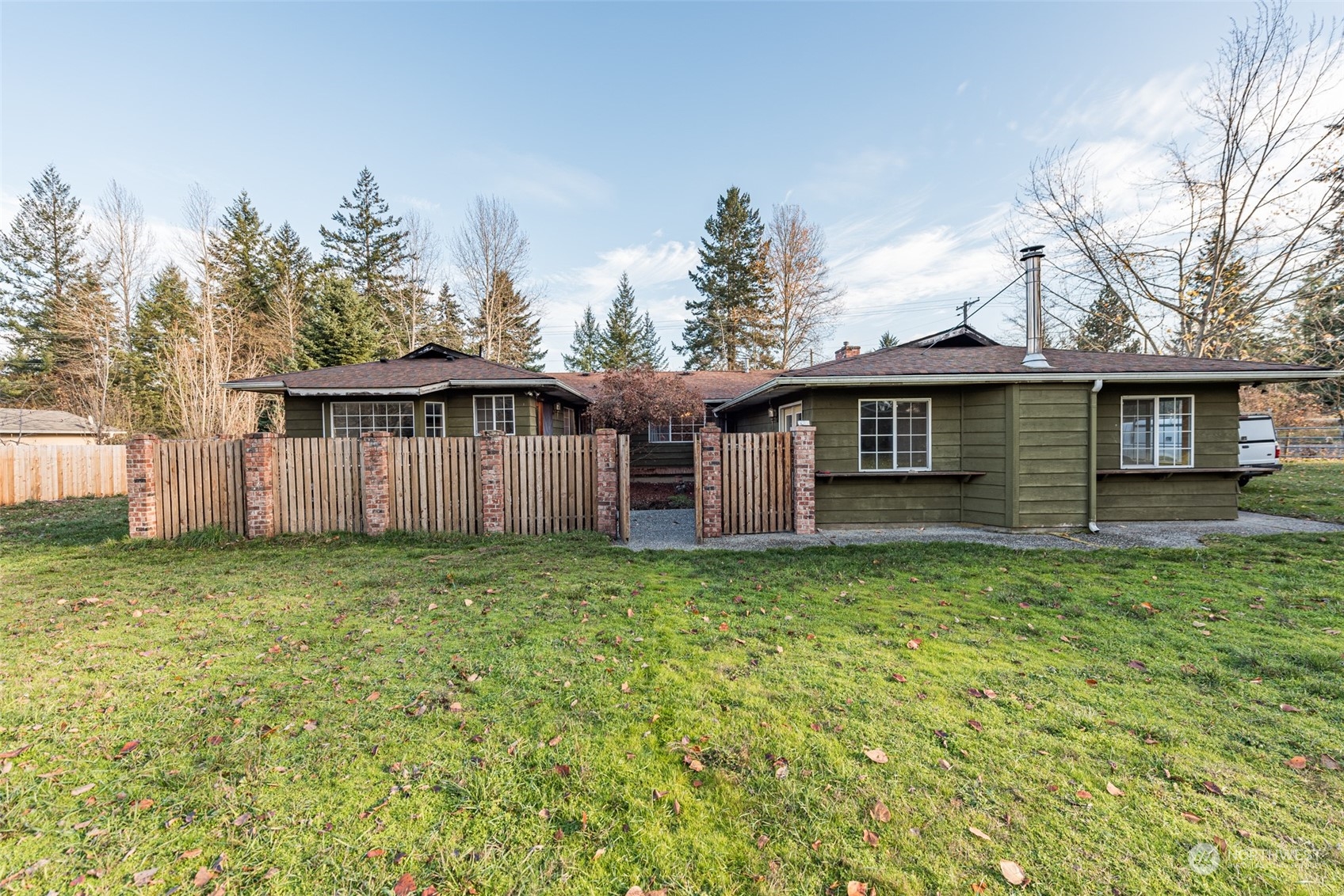 970 River Road Sequim, WA 98382 - Photo 18 of 40 a view of a house with yard and a garden