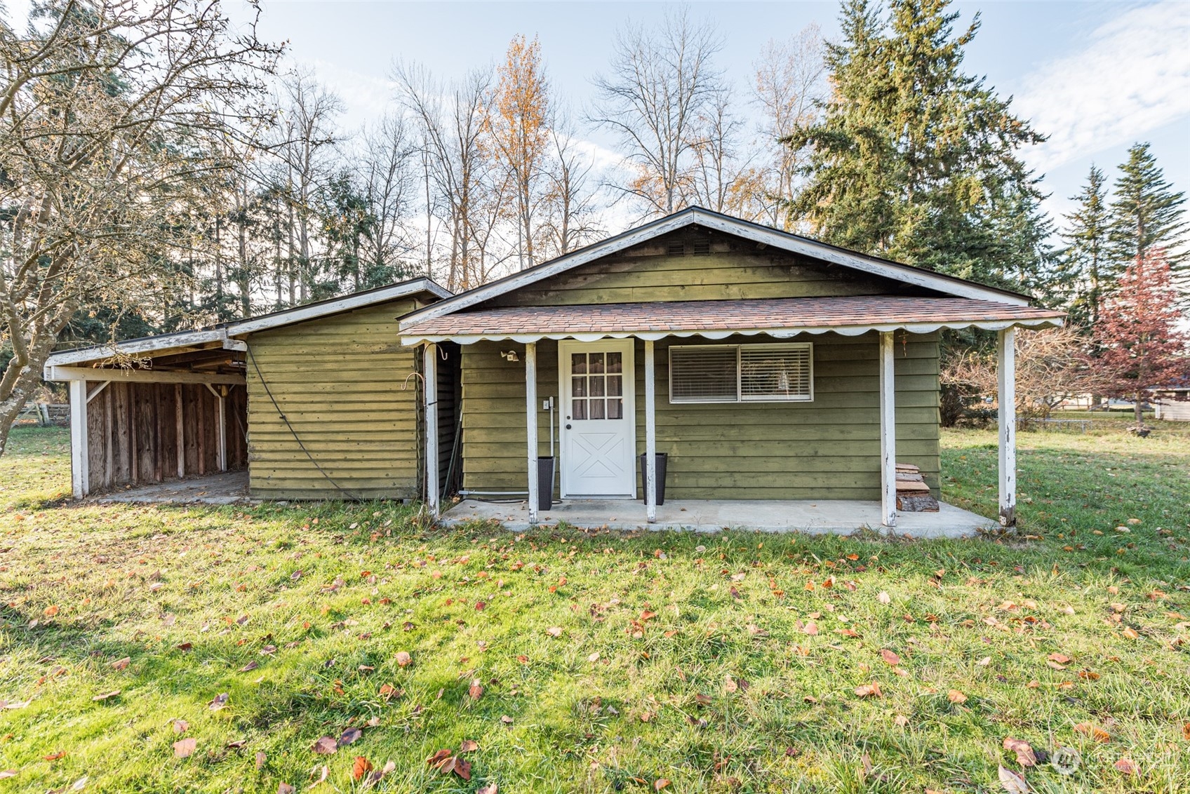 970 River Road Sequim, WA 98382 - Photo 20 of 40 a house with trees in the background