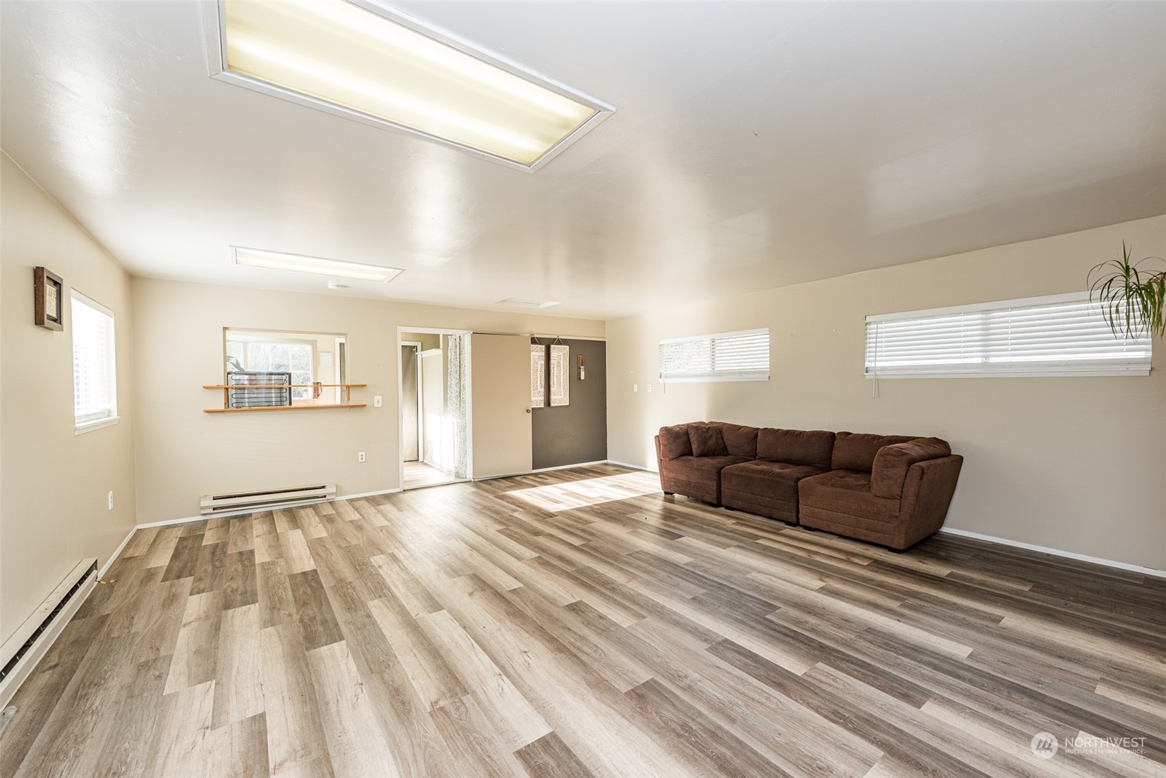 970 River Road Sequim, WA 98382 - Photo 21 of 40 a living room with furniture and a wooden floor