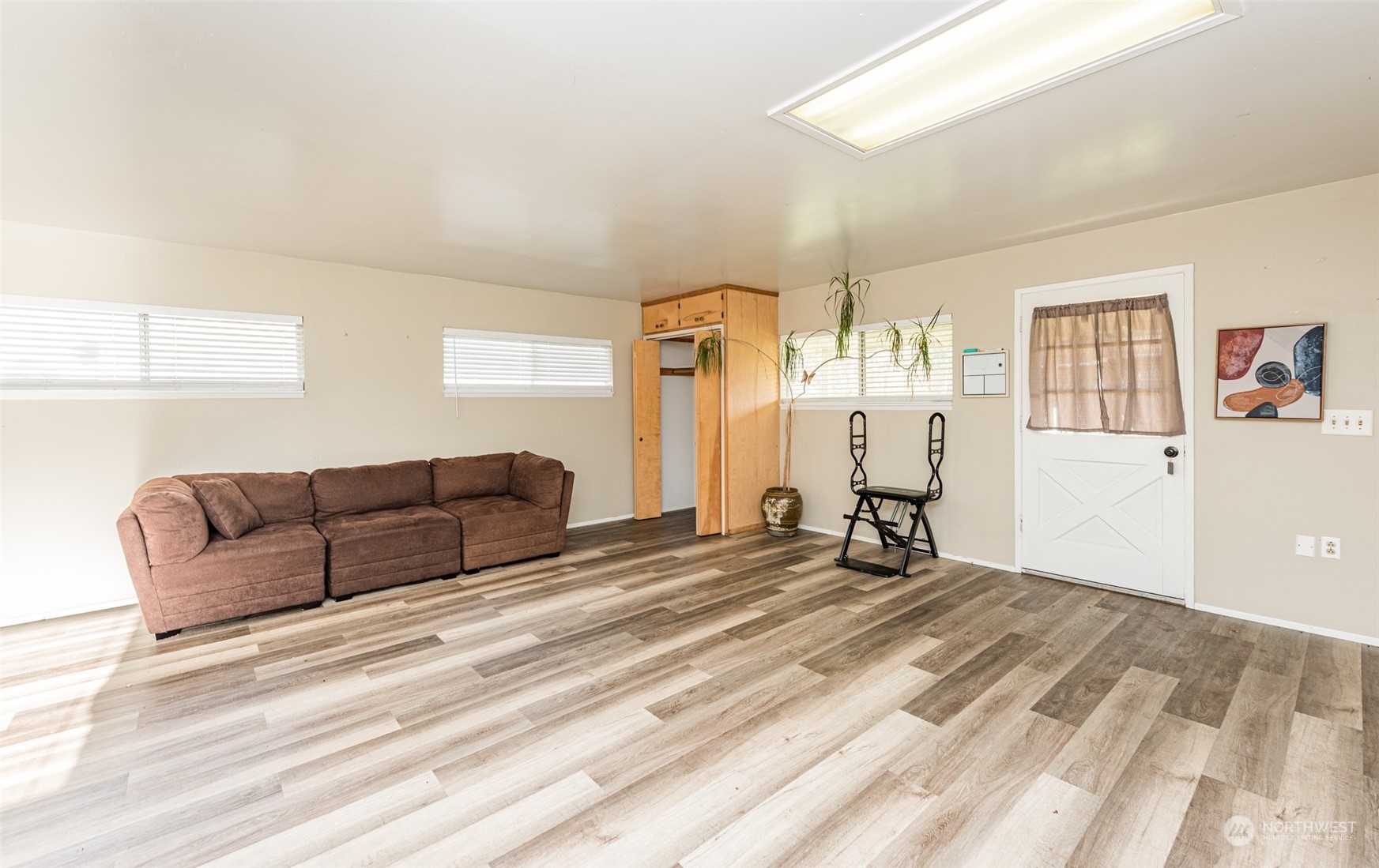 970 River Road Sequim, WA 98382 - Photo 23 of 40 a living room with a couch and a window
