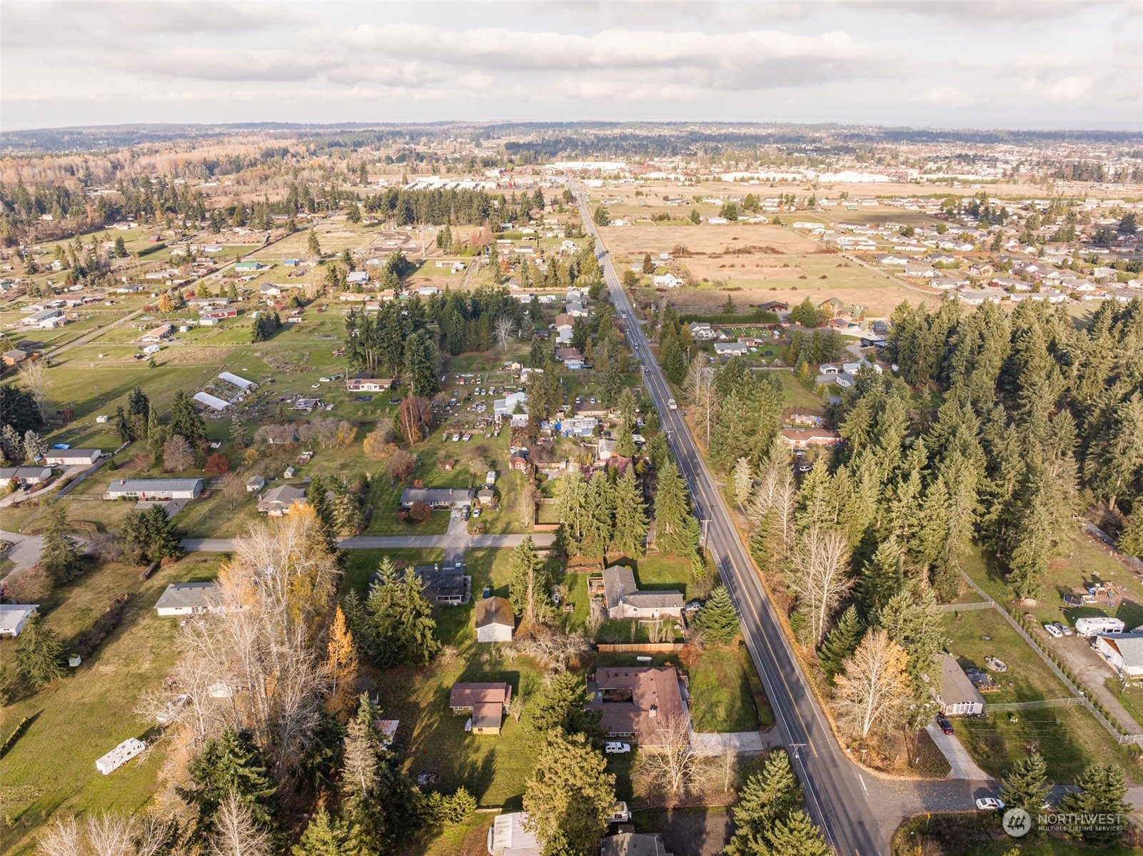 970 River Road Sequim, WA 98382 - Photo 35 of 40 an aerial view of residential building with parking space