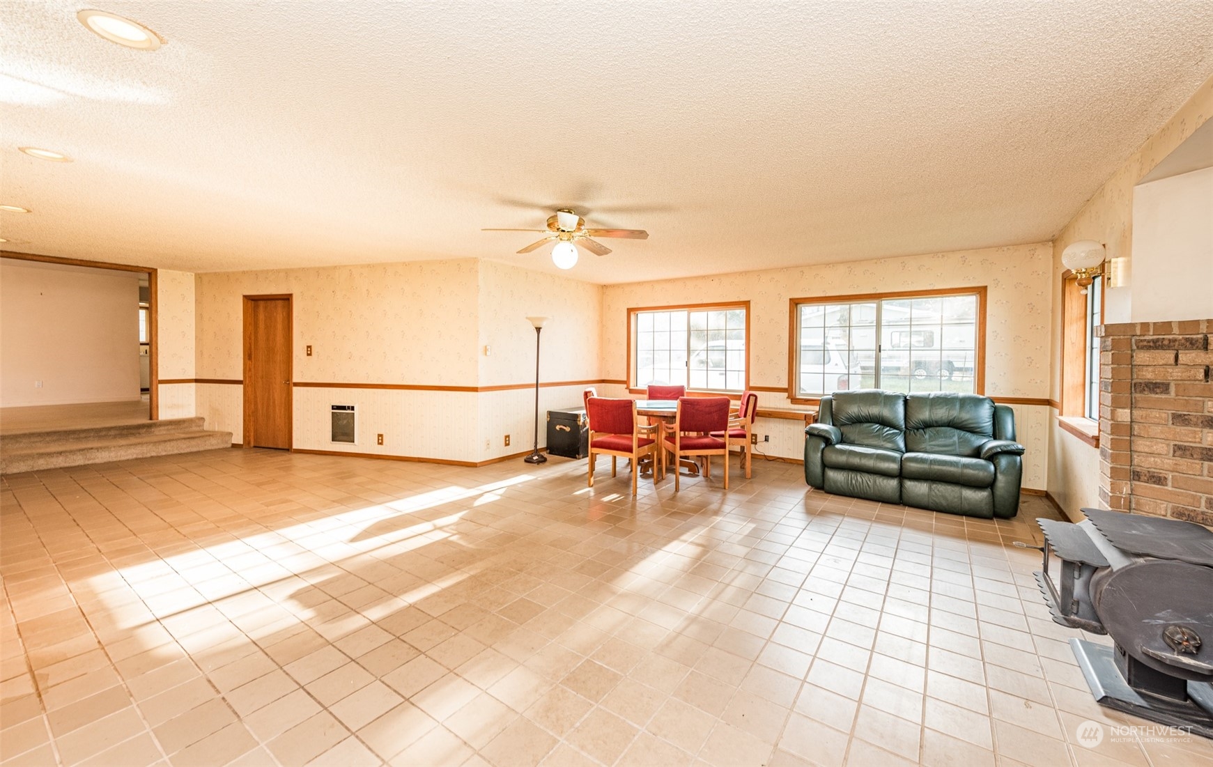 970 River Road Sequim, WA 98382 - Photo 8 of 40 a living room with furniture and a flat screen tv