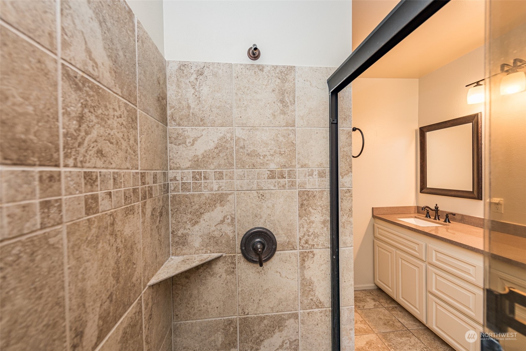 970 River Road Sequim, WA 98382 - Photo 10 of 40 a bathroom with a sink and a mirror