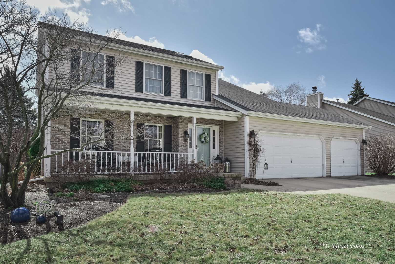 front view of a house with a yard