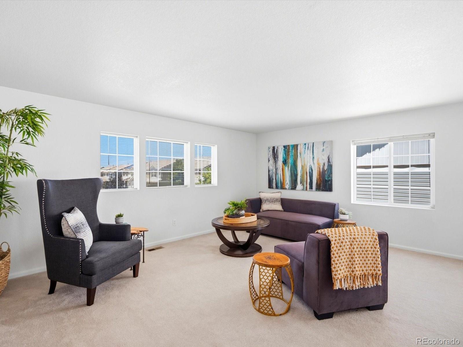 5444 Perth Court Denver, CO 80249 - Photo 20 of 46 a living room with furniture and a window