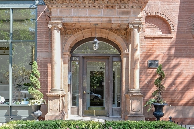 104 West Oak Street, Unit 2W Chicago, IL 60610 - Photo 2 of 17 a front view of a house with plants