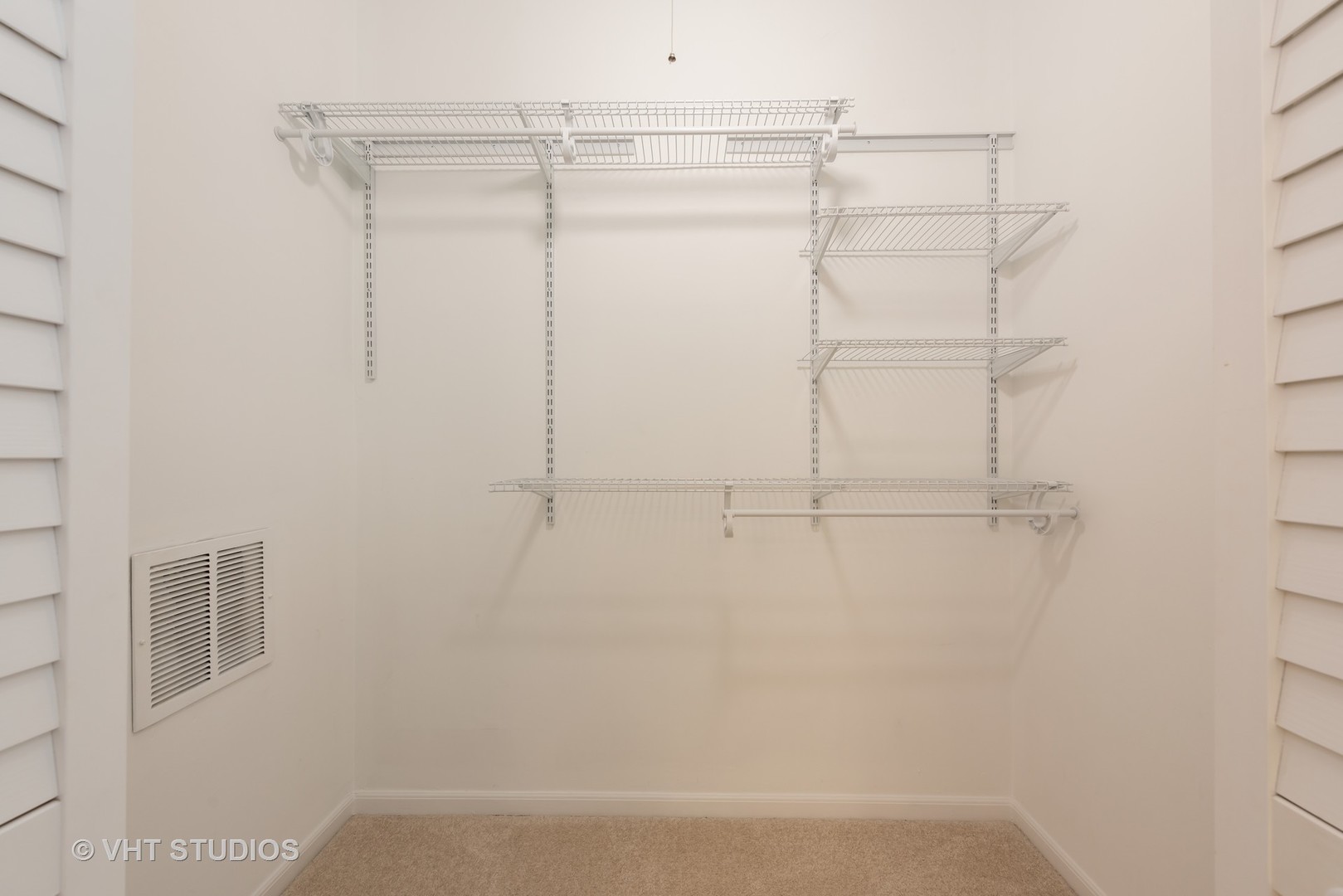104 West Oak Street, Unit 2W Chicago, IL 60610 - Photo 13 of 17 a view of a room with racks on the wall