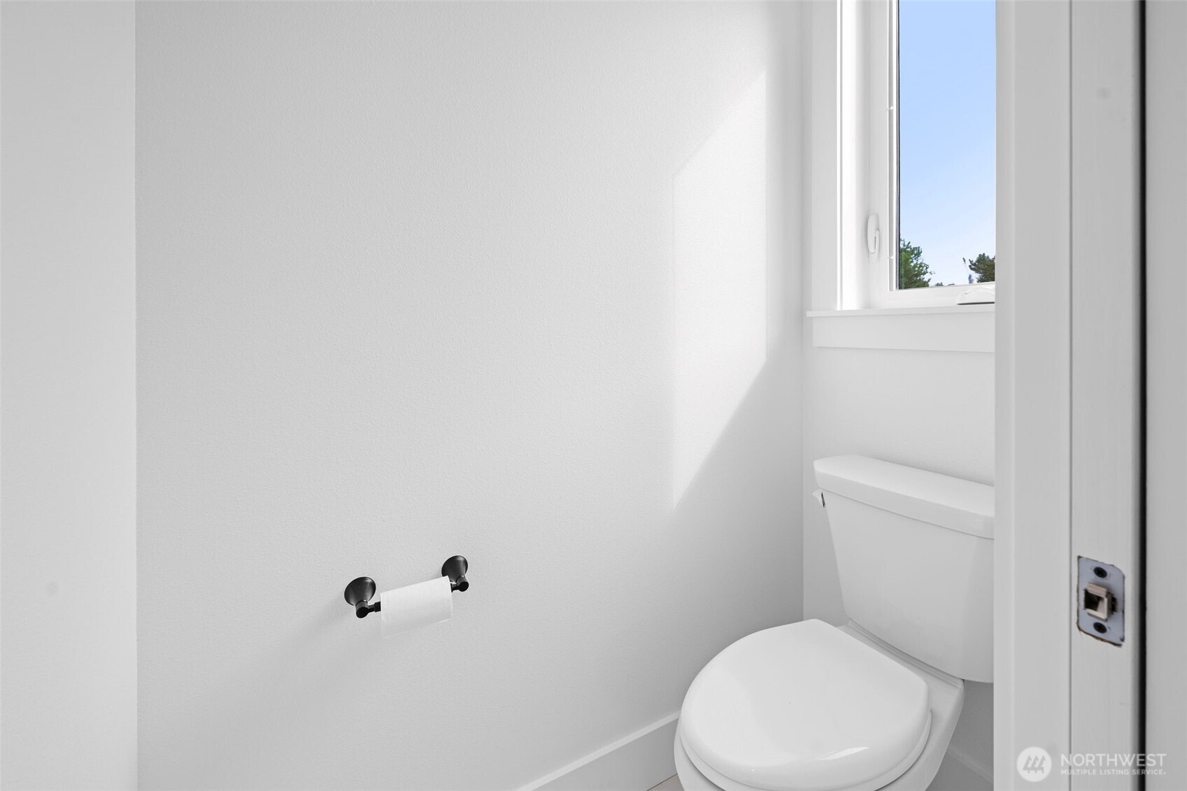 1306 195th Street Long Beach, WA 98631 - Photo 14 of 24 a white toilet sitting next to a white sink