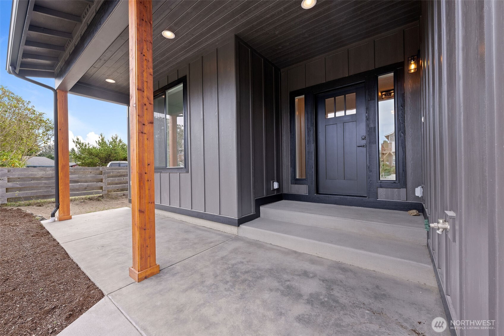 1306 195th Street Long Beach, WA 98631 - Photo 3 of 24 a view of a hallway with wooden walls