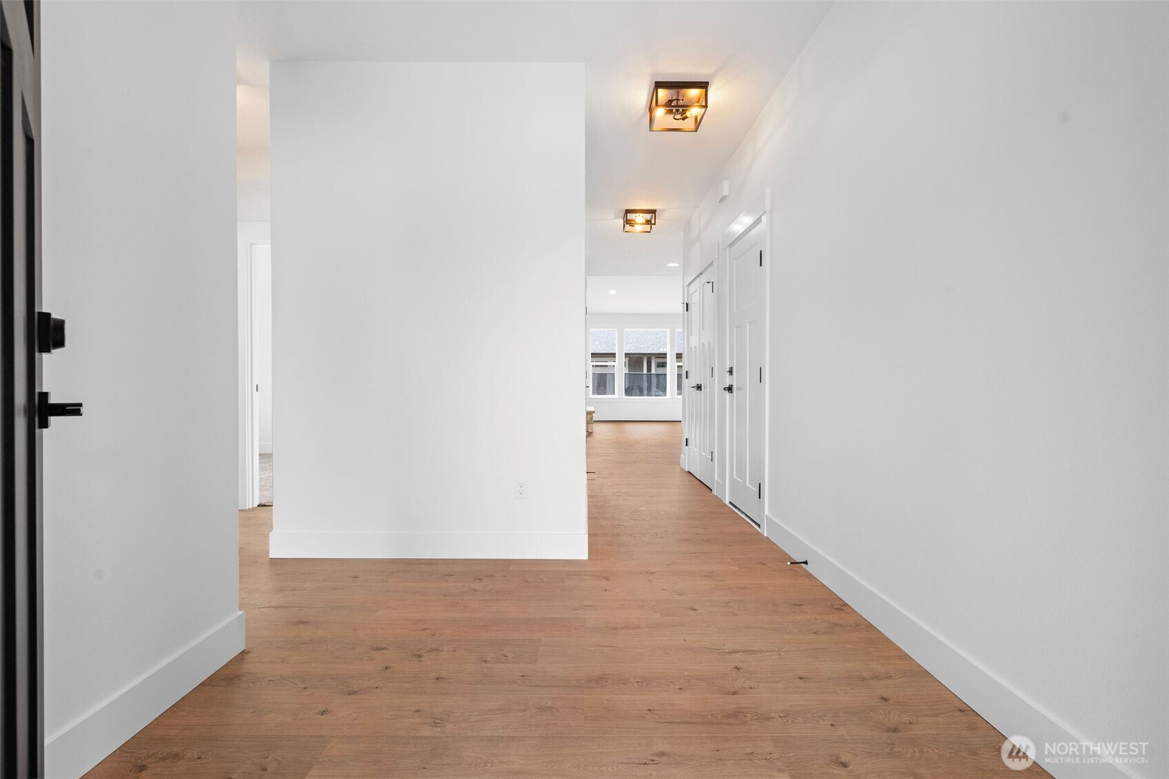 1306 195th Street Long Beach, WA 98631 - Photo 4 of 24 a view of a hallway with wooden floor