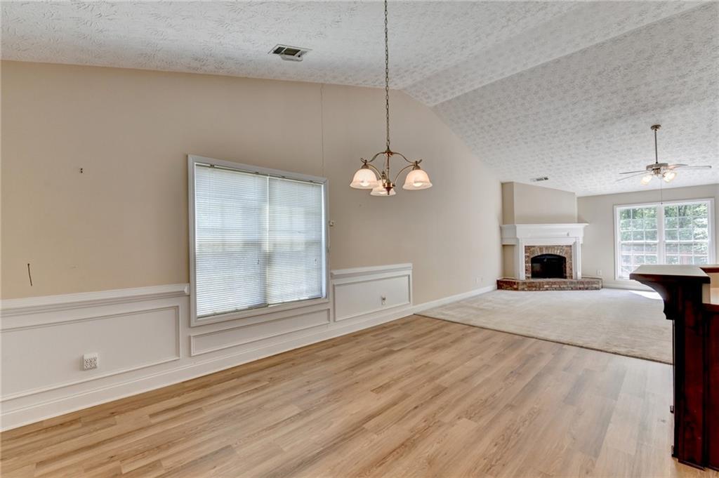 52 Katie Spring Lane Jefferson, GA 30549 - Photo 19 of 57 a bedroom with a bed and a fireplace