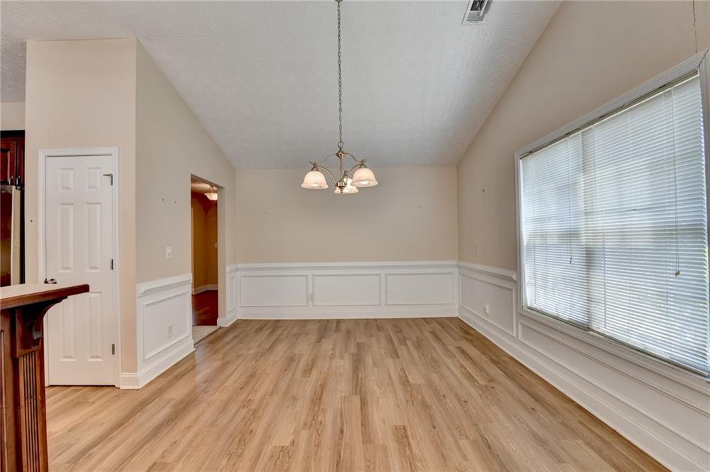 52 Katie Spring Lane Jefferson, GA 30549 - Photo 21 of 57 a view of a room with wooden floor and a window
