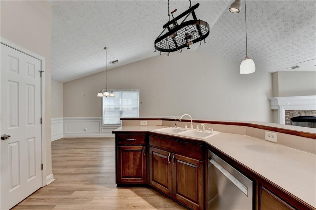 52 Katie Spring Lane Jefferson, GA 30549 - Photo 30 of 57 a kitchen with a sink cabinets and window