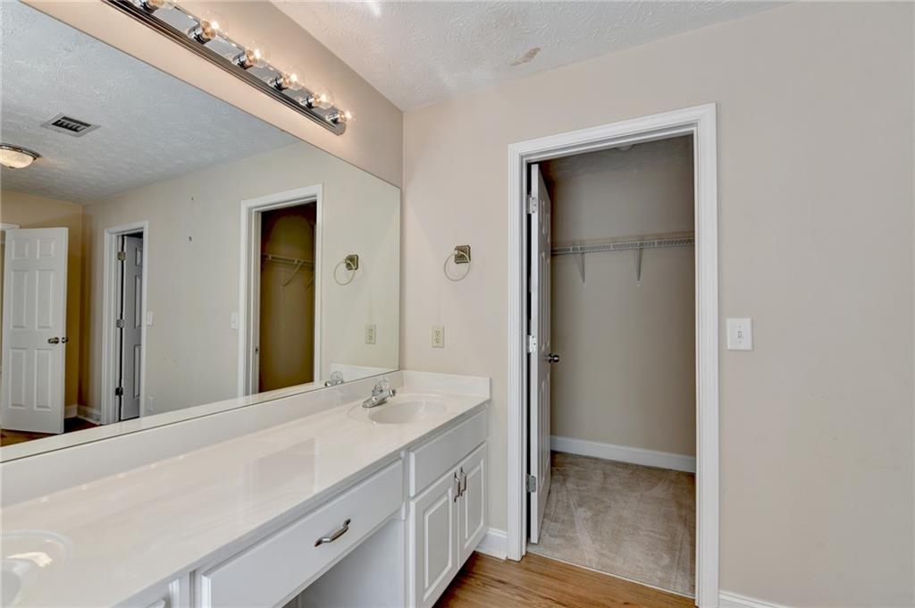 52 Katie Spring Lane Jefferson, GA 30549 - Photo 40 of 57 a bathroom with a double vanity sink and a mirror