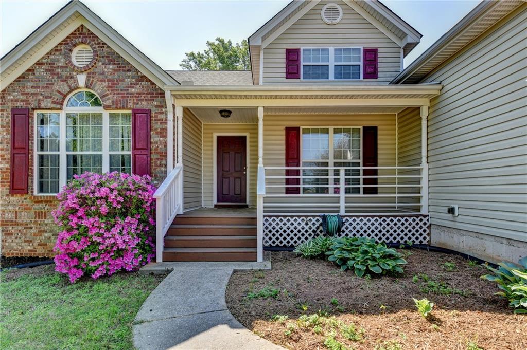 52 Katie Spring Lane Jefferson, GA 30549 - Photo 4 of 57 a front view of a house with garden