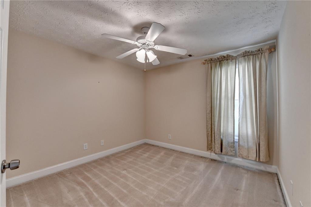 52 Katie Spring Lane Jefferson, GA 30549 - Photo 41 of 57 an empty room with windows and fan