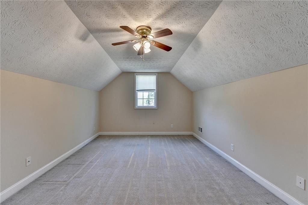 52 Katie Spring Lane Jefferson, GA 30549 - Photo 46 of 57 an empty room with windows and fan