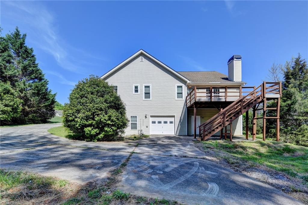 52 Katie Spring Lane Jefferson, GA 30549 - Photo 54 of 57 a view of a house with a yard and plants
