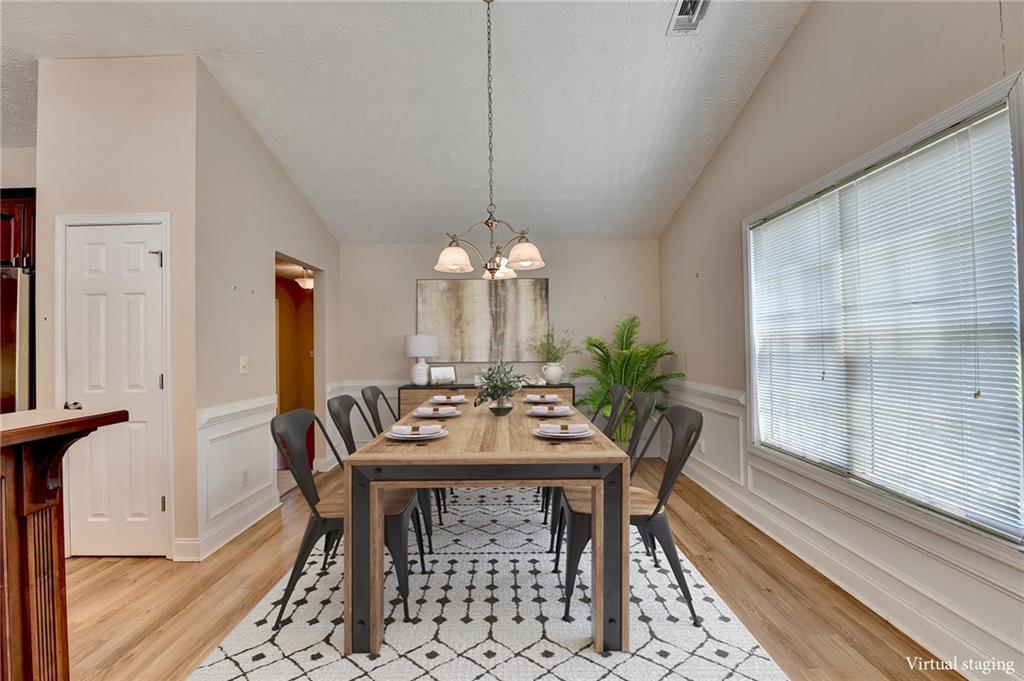 52 Katie Spring Lane Jefferson, GA 30549 - Photo 7 of 57 a view of a dining room with furniture window and wooden floor