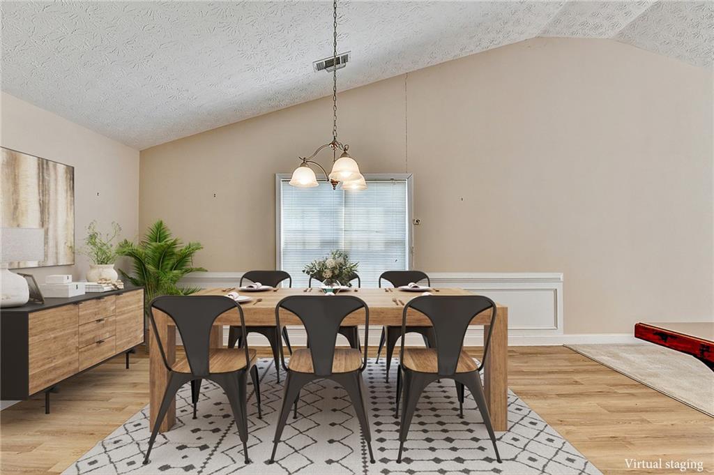 52 Katie Spring Lane Jefferson, GA 30549 - Photo 8 of 57 a view of a dining room with furniture and chandelier