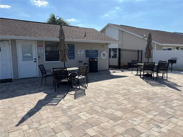 a view of a swimming pool with a lounge chair