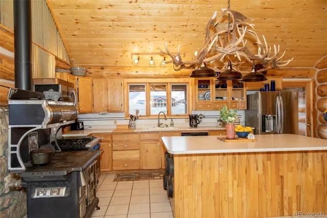 a view of a kitchen with a sink and cabinets