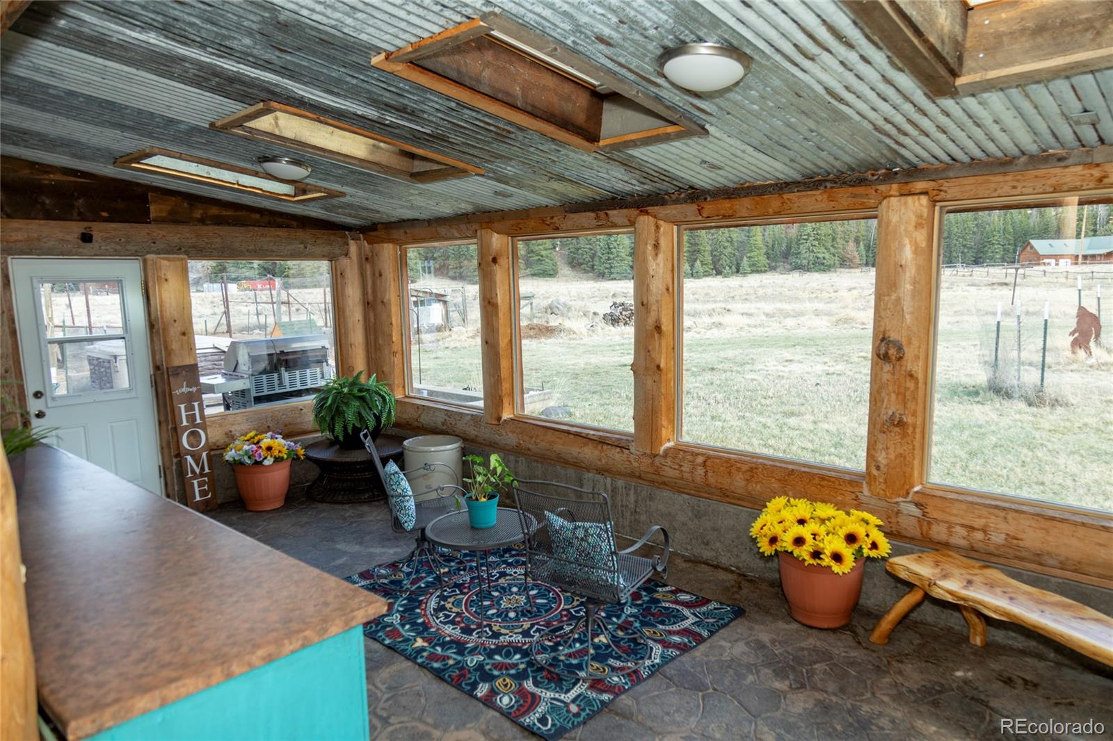 108 Forest Road, Unit 552 Creede, CO 81130 - Photo 29 of 32 a lobby room with furniture and floor to ceiling window