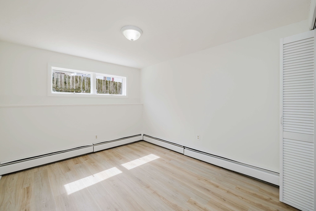 194 Albion Street Fall River, MA 02723 - Photo 12 of 42 a view of a room with wooden floor and window
