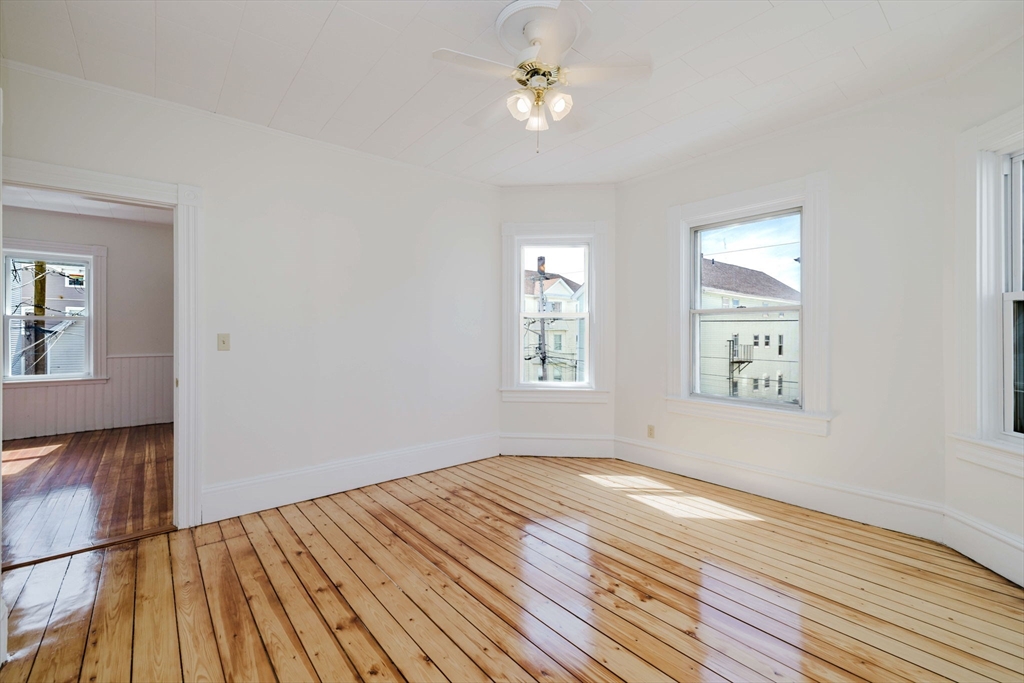 194 Albion Street Fall River, MA 02723 - Photo 26 of 42 a view of empty room with wooden floor and fan