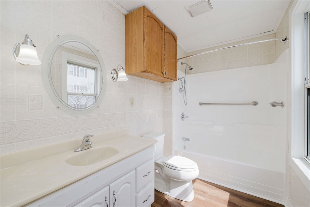 194 Albion Street Fall River, MA 02723 - Photo 27 of 42 a bathroom with a sink a toilet and a mirror