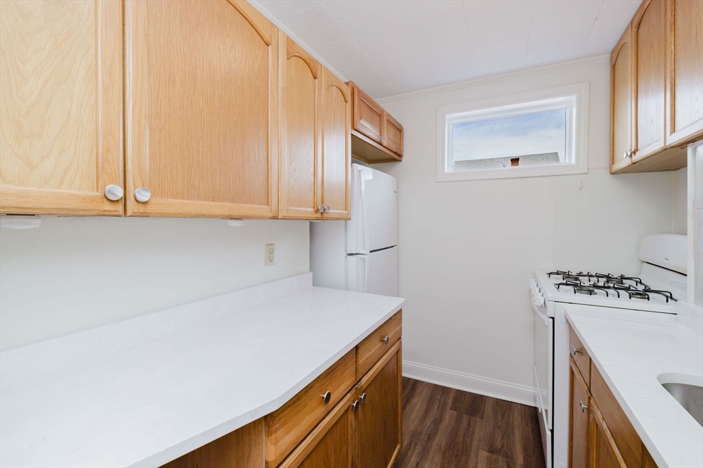 194 Albion Street Fall River, MA 02723 - Photo 31 of 42 a view of a kitchen with cabinets and wooden floor