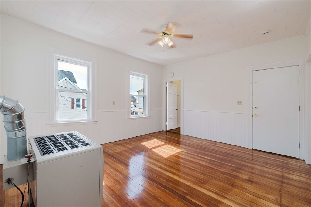 194 Albion Street Fall River, MA 02723 - Photo 35 of 42 a view of an empty room with window and wooden floor