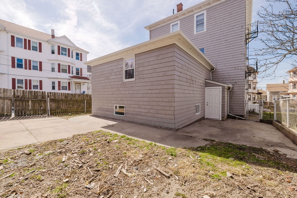 194 Albion Street Fall River, MA 02723 - Photo 7 of 42 a view of a backyard with a large tree