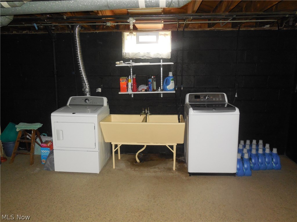 1271 Roland Road Lyndhurst, OH 44124 - Photo 26 of 27 Lower level Utility area with Nature Stone Floor, washer and dryer to be replaced