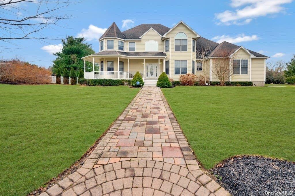 69 Meadow Path Wading River, NY 11792 - Photo 1 of 1 a front view of a house with a yard