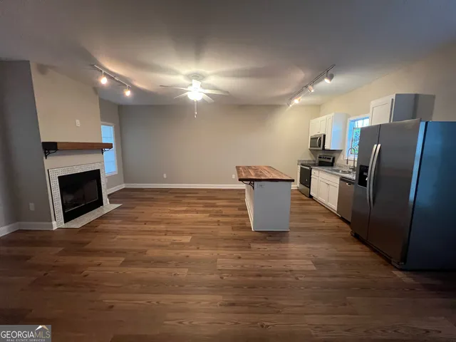 a view of kitchen with furniture and a fireplace