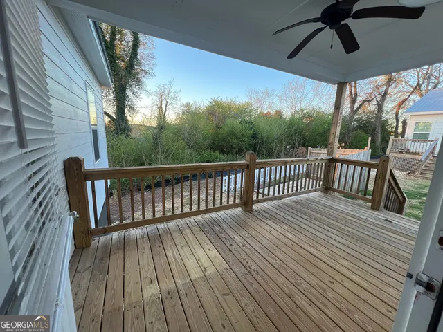 a view of balcony with wooden floor